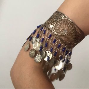 Metal bracelet with pendants.